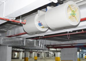 Why is it necessary to install a fresh air supply fan for the building basement?